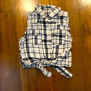 flannel button up and tied up at the bottom